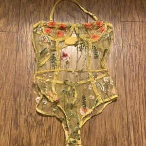Sheer Embroidered flower bodysuit.